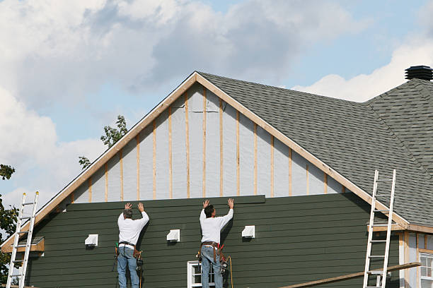 Professional Storm Damage Siding Repair technician working in Carrollton, VA